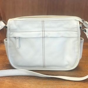 White leather fossil purse with a slight wear